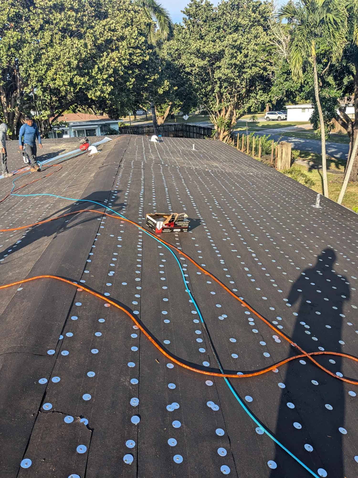 Grey architectural shingle re-roof by DR Construction & Roofing in South Florida