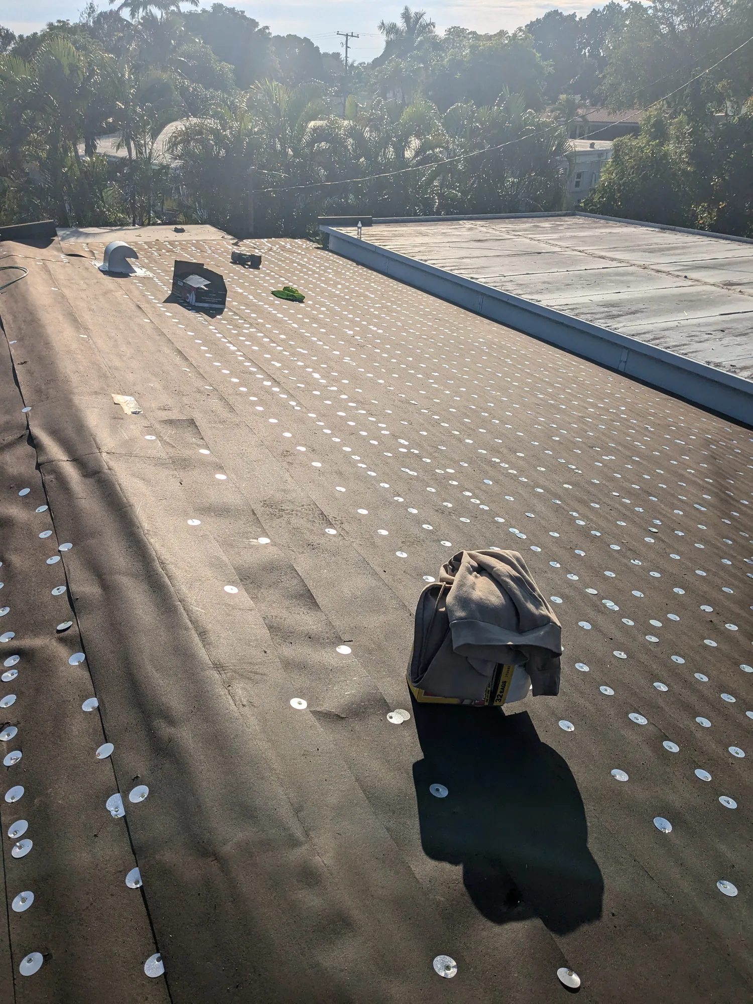 Grey architectural shingle re-roof by DR Construction & Roofing in South Florida