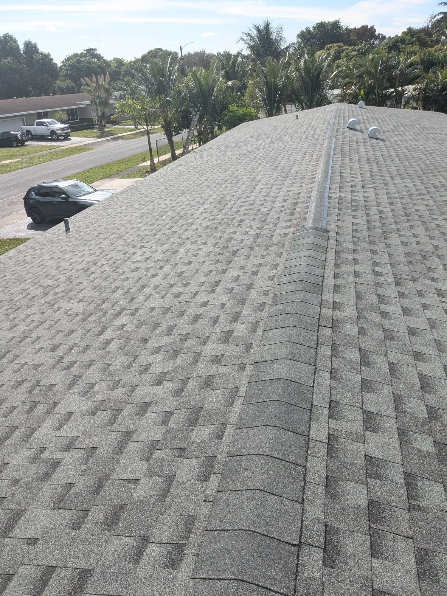 Grey architectural shingle re-roof by DR Construction & Roofing in South Florida