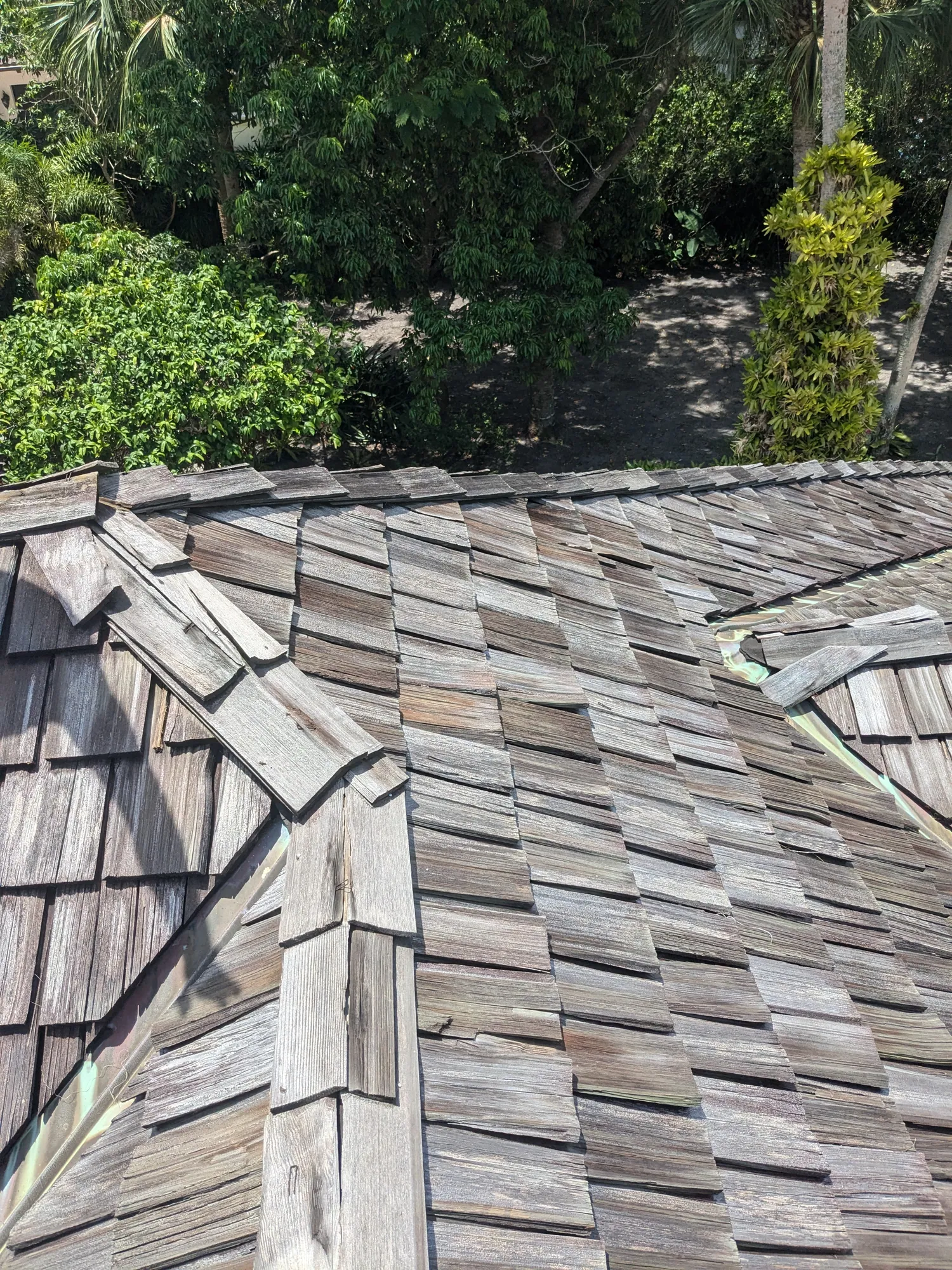 Charcoal flat tile roof installation by DR Construction & Roofing in South Florida