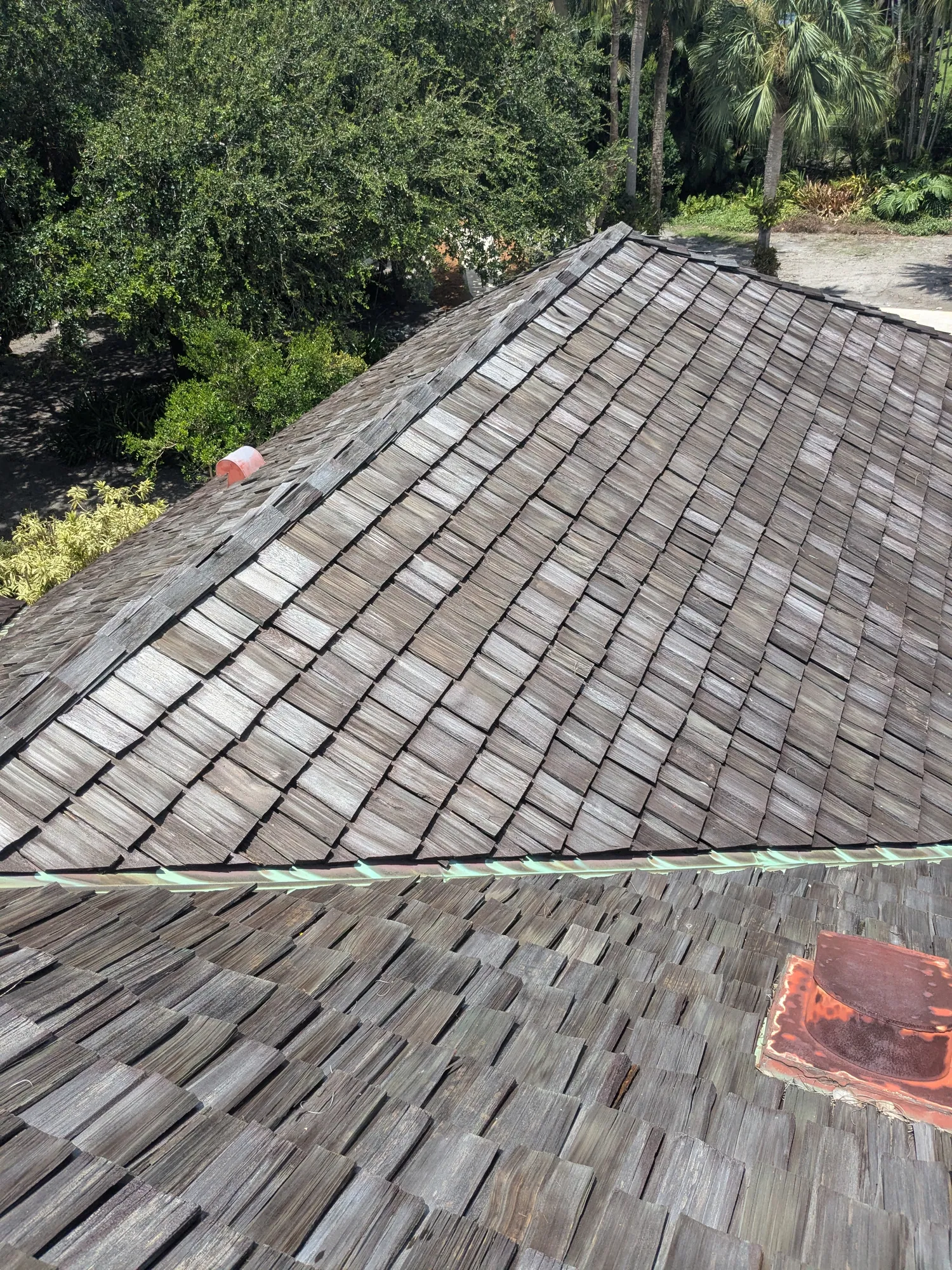 Charcoal flat tile roof installation by DR Construction & Roofing in South Florida