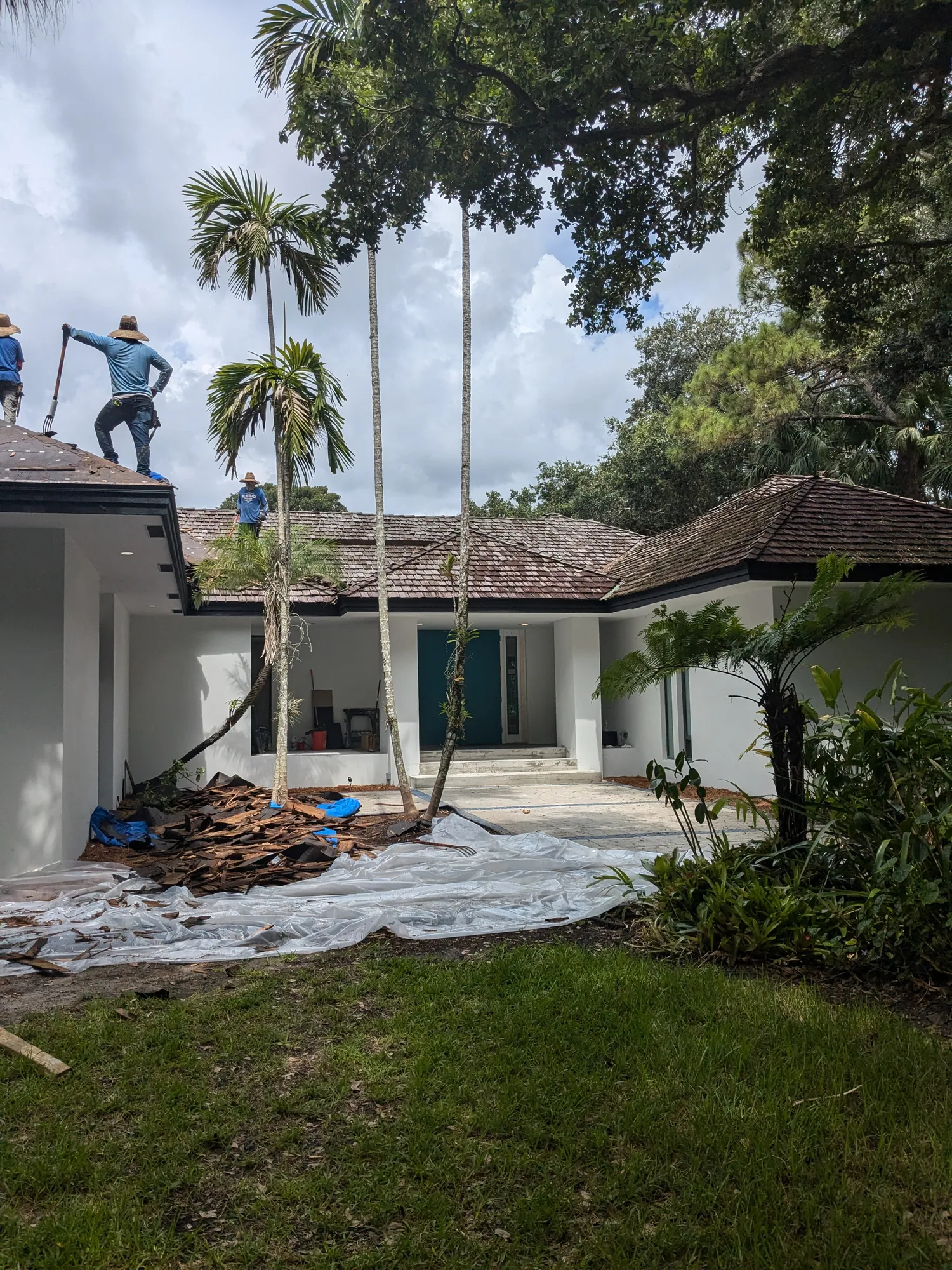 Charcoal flat tile roof installation by DR Construction & Roofing in South Florida