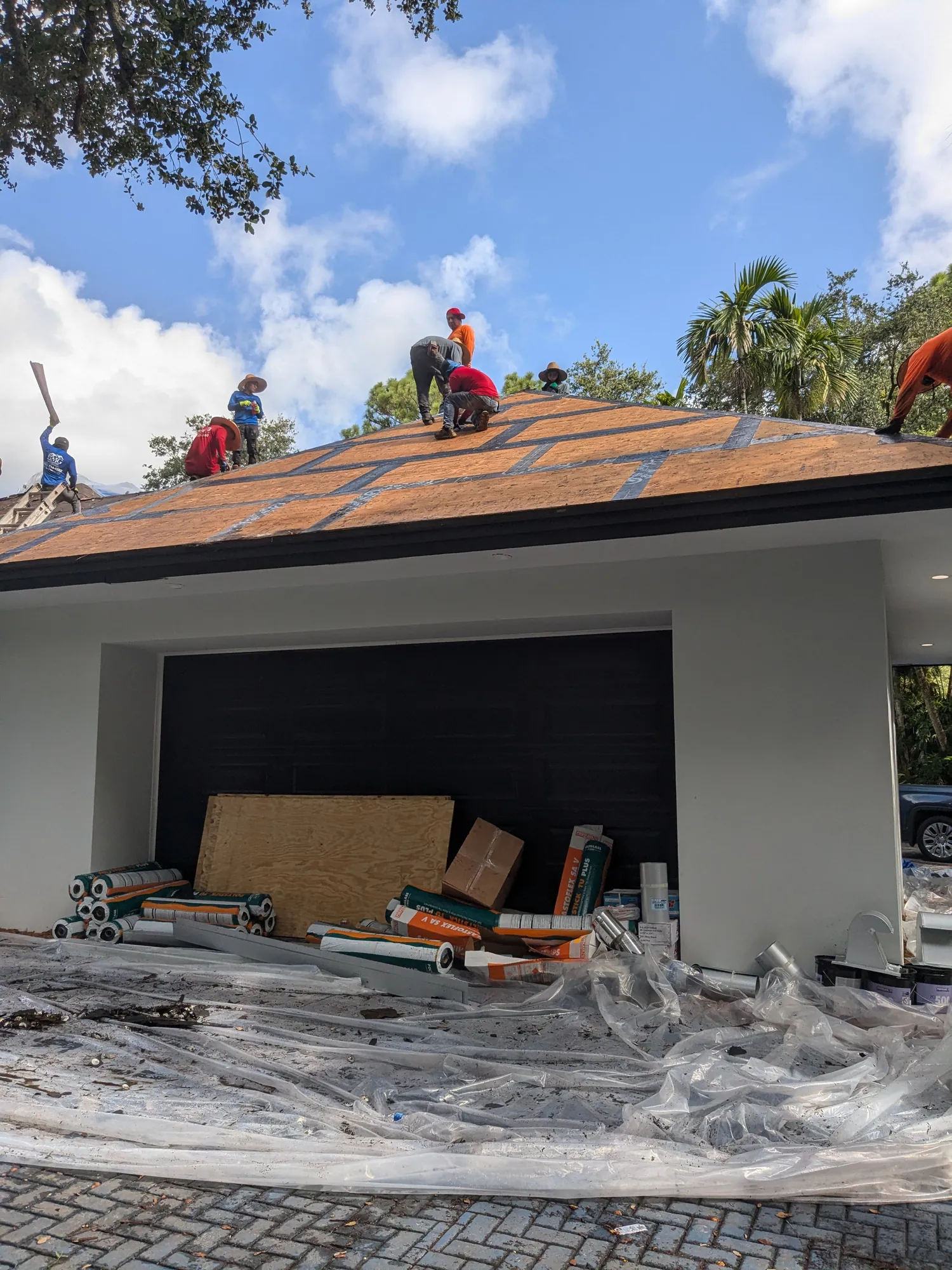 Charcoal flat tile roof installation by DR Construction & Roofing in South Florida