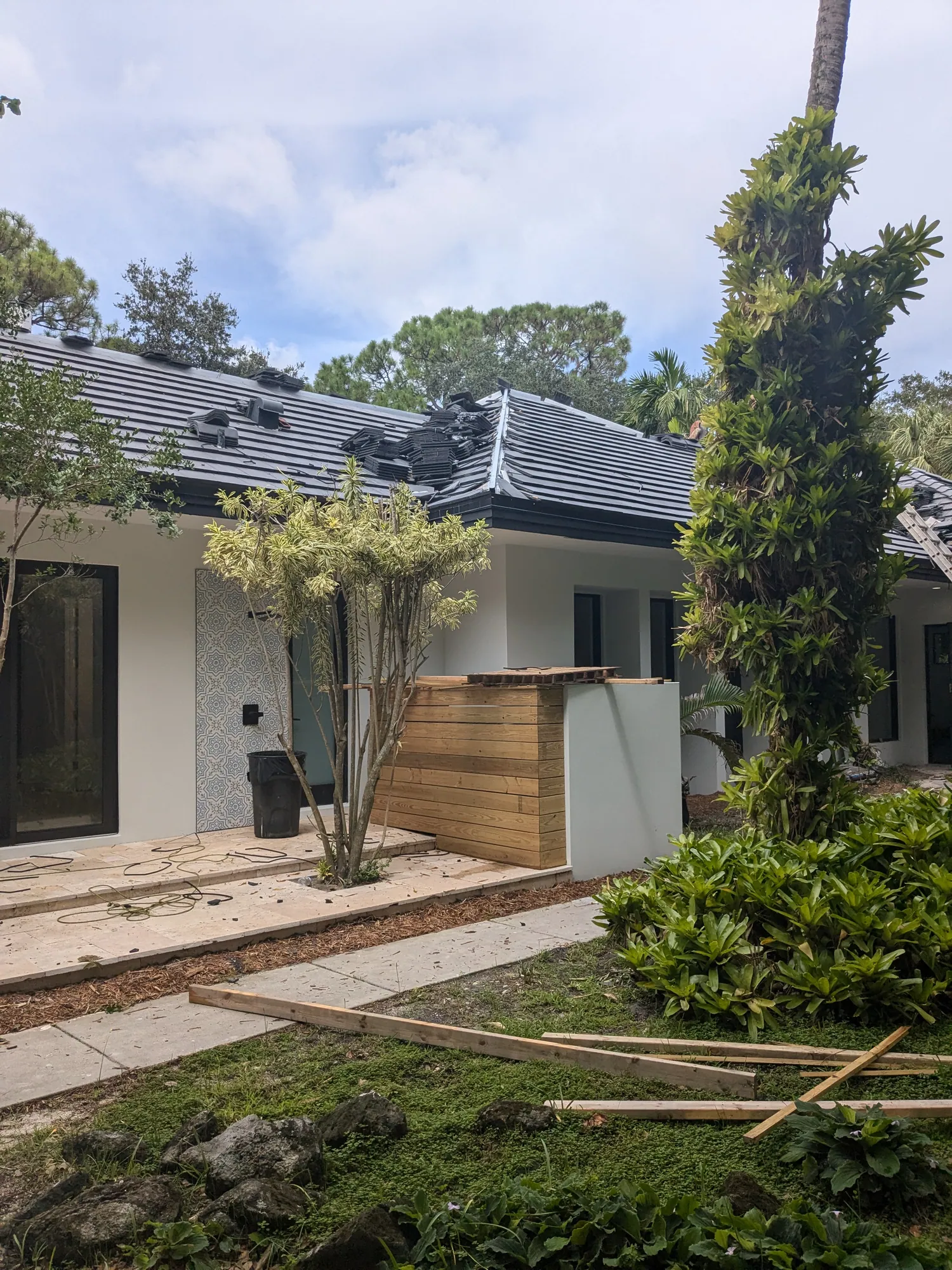 Charcoal flat tile roof installation by DR Construction & Roofing in South Florida