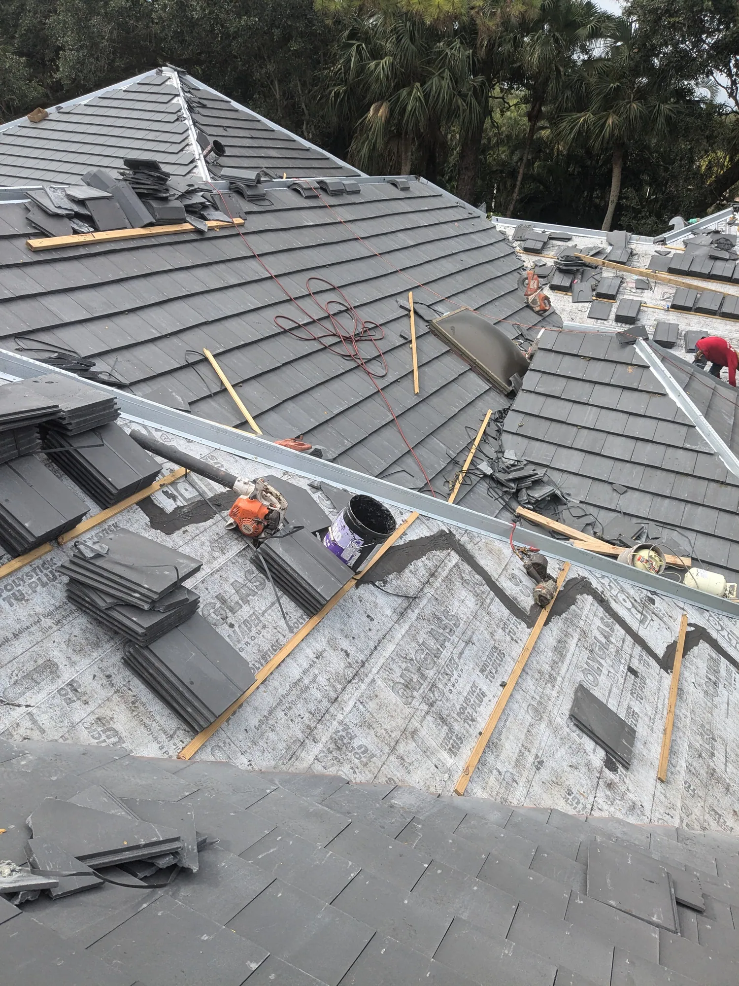 Charcoal flat tile roof installation by DR Construction & Roofing in South Florida
