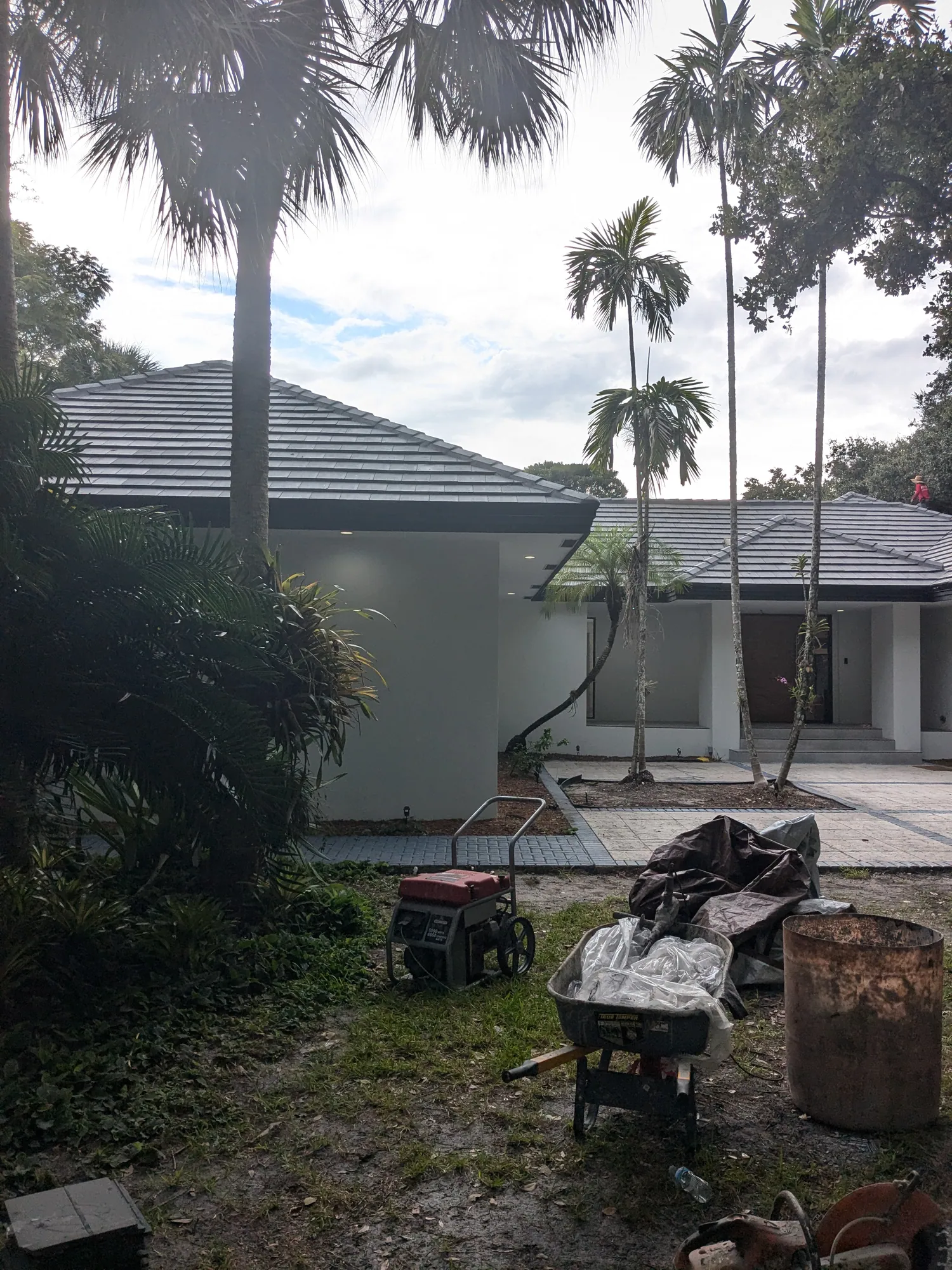 Finished charcoal flat tile roof installed by DR Construction & Roofing on a South Florida luxury home