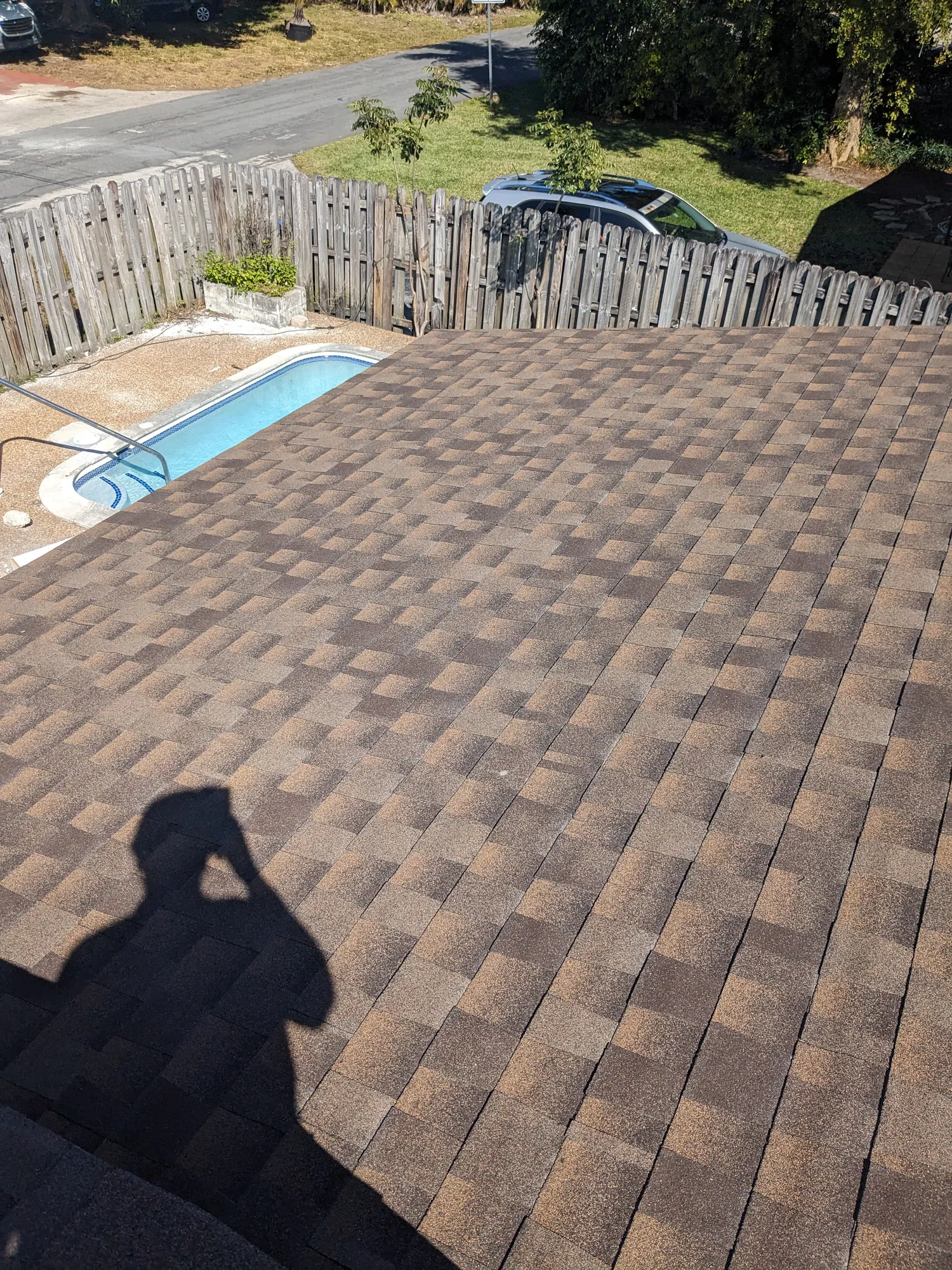 Brown architectural shingle re-roof by DR Construction & Roofing in South Florida