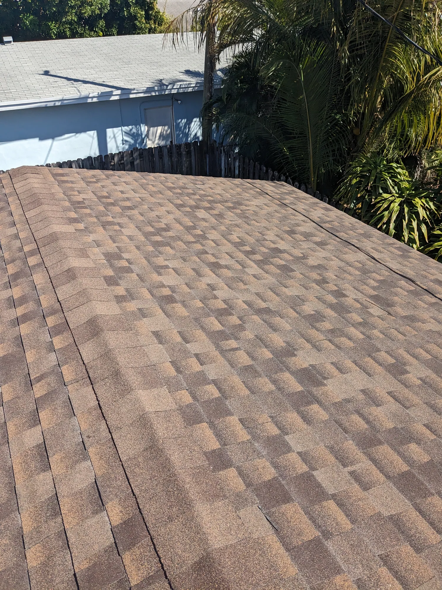 Brown architectural shingle re-roof by DR Construction & Roofing in South Florida