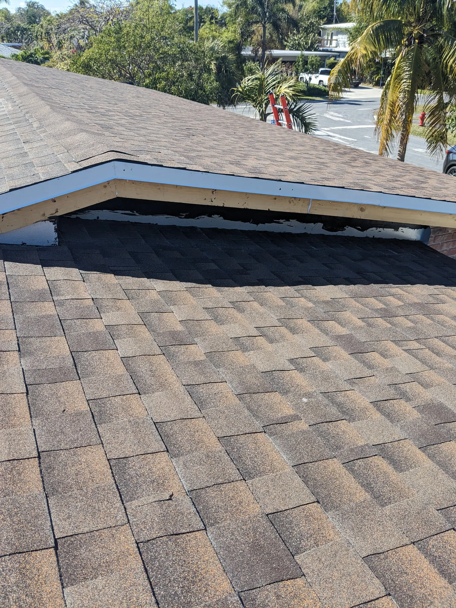 Brown architectural shingle re-roof by DR Construction & Roofing in South Florida
