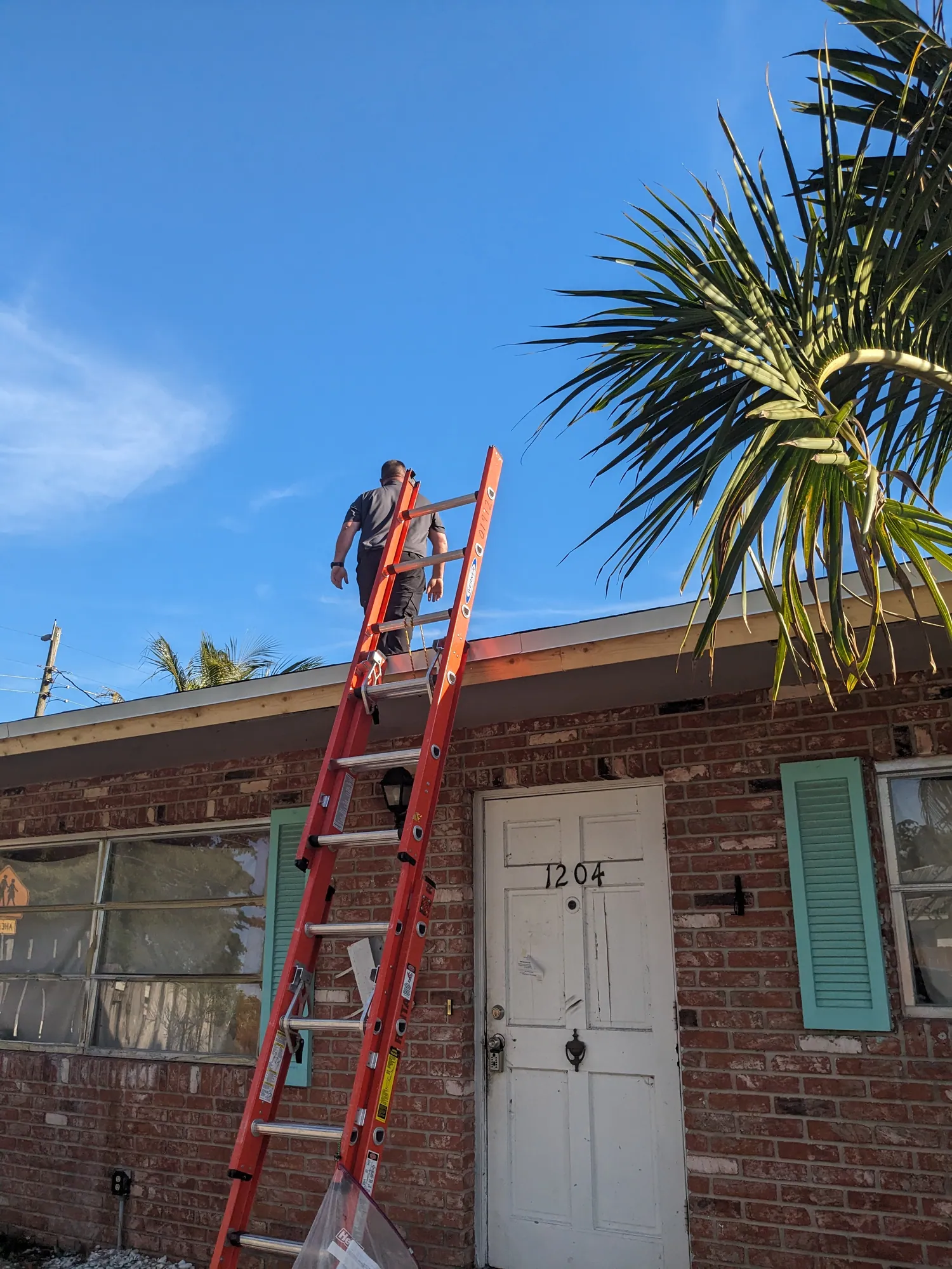 Brown architectural shingle re-roof by DR Construction & Roofing in South Florida