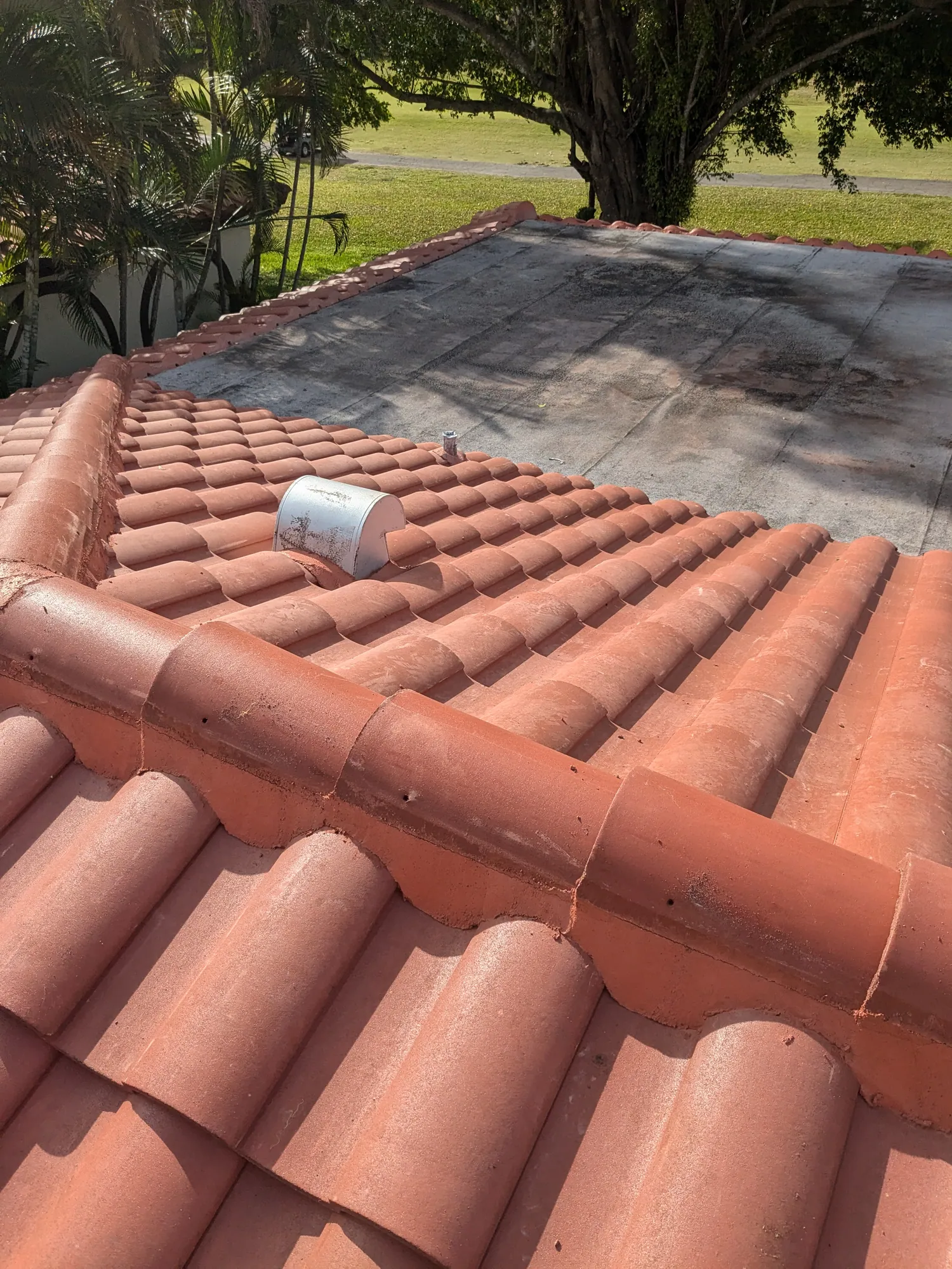 Terracotta barrel tile roof installation by DR Construction & Roofing in South Florida