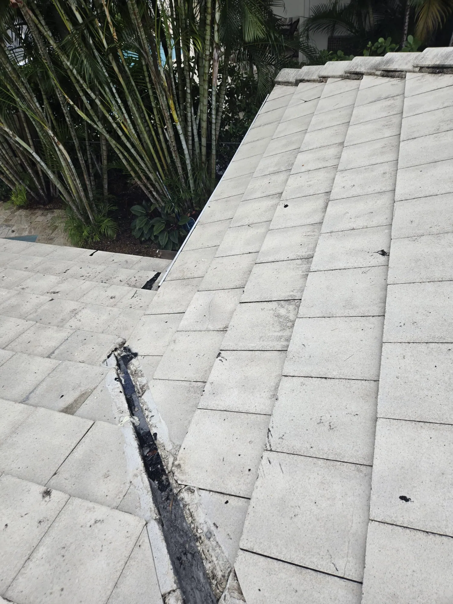 Tile roof damage exposed before DR Construction begins repair